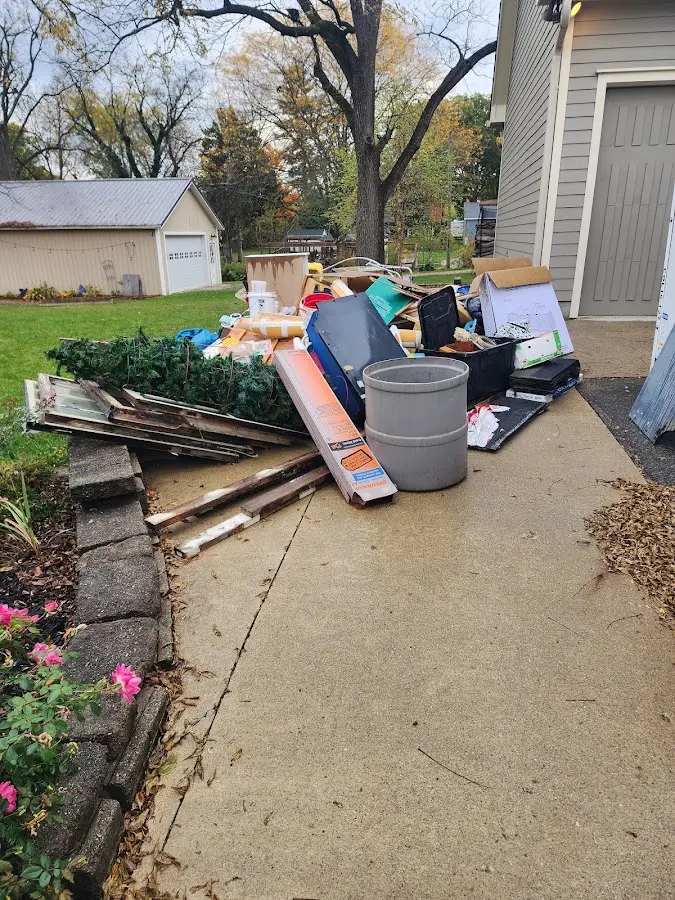 Dumpster being loaded with debris for 3 Yard Dumpster Rental in Wheelersburg